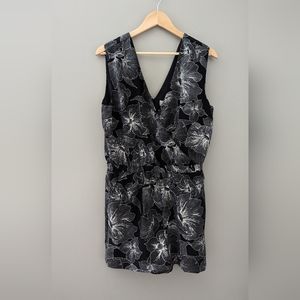 Beautiful NWOT Loft black and white, sleeveless floral romper. Has pockets.